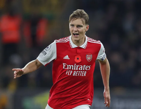 stock image Martin degaard #8 of Arsenal celebrates his goal to make it 0-2 during the Premier League match Wolverhampton Wanderers vs Arsenal at Molineux, Wolverhampton, United Kingdom, 12th November 2022