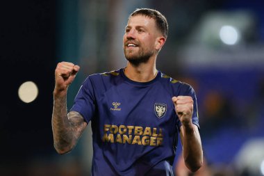 AFC Wimbledon 'dan Harry Pell, 19 Kasım 2022' de İngiltere 'nin Birkenhead kentinde oynanan Uluslararası İddia Ligi 2 karşılaşmasında Tranmere Rovers' a karşı AFC Wimbledon maçını kutladı.