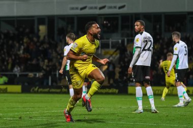 Burton Albion 'dan Adrian Mariappa, 19 Kasım 2022 tarihinde İngiltere' nin başkenti Trent 'te oynanan Sky Bet 1 karşılaşmasında Burton Albion' a karşı Plymouth Argyle maçında 2-2 'lik galibiyetini kutluyor.