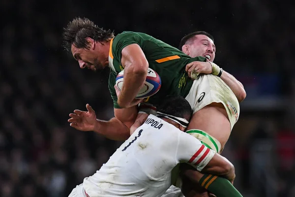 stock image Eben Etzebeth of South Africa is tackled by Mako Vunipola and Tom Curry of England during the Autumn internationals match England vs South Africa at Twickenham Stadium, Twickenham, United Kingdom, 26th November 2022