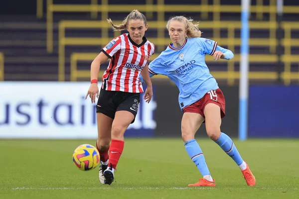 stock image Esme Morgan #14 of Manchester City and Holly Manders #21 of Sunderland challenge for the ball during the FA Womens Continental League Cup match Manchester City Women vs Sunderland AFC Women at Etihad Campus, Manchester, UK, 27th November 2022