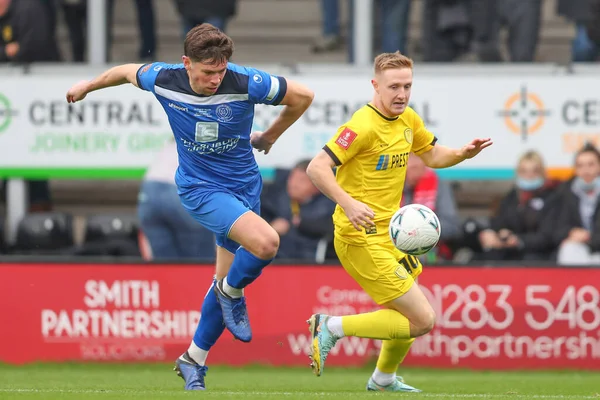 stock image William Richards #6 of Chippenham Town and Davis Keillor-Dunn #10 of Burton Albion battle for the ball during the Emirates FA Cup Round 2 match Burton Albion vs Chippenham Town at Pirelli Stadium, Burton upon Trent, United Kingdom, 27th November 2022