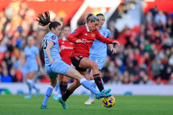 stock image Alessia Russo #23 of Manchester United and Danielle Turner #14 of Aston Villa challenge for the ball during The FA Women's Super League match Manchester United Women vs Aston Villa Women at Old Trafford, Manchester, United Kingdom, 3rd December 202