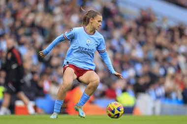 Kerstin Casparij #2 of Manchester City controls the ball during of the The FA Women's Super League match Manchester City Women vs Manchester United Women at Etihad Campus, Manchester, United Kingdom, 11th December 2022 clipart