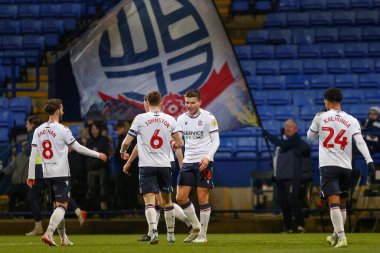 Bolton Wanderers 'dan Aaron Morley 13 Aralık 2022' de Bolton Stadyumu, Bolton Üniversitesi 'nde oynanan Papa John' s Trophy maçında 2-0 kazanma hedefini kutluyor.
