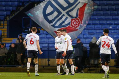 Bolton Wanderers 'dan Aaron Morley 13 Aralık 2022' de Bolton Stadyumu, Bolton Üniversitesi 'nde oynanan Papa John' s Trophy maçında 2-0 kazanma hedefini kutluyor.