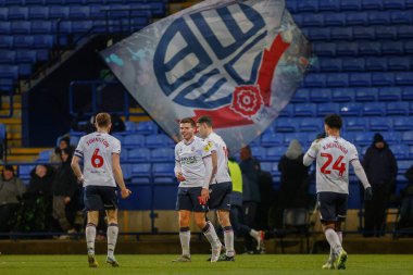 Bolton Wanderers 'dan Aaron Morley 13 Aralık 2022' de Bolton Stadyumu, Bolton Üniversitesi 'nde oynanan Papa John' s Trophy maçında 2-0 kazanma hedefini kutluyor.