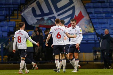 Bolton Wanderers 'dan Aaron Morley 13 Aralık 2022' de Bolton Stadyumu, Bolton Üniversitesi 'nde oynanan Papa John' s Trophy maçında 2-0 kazanma hedefini kutluyor.