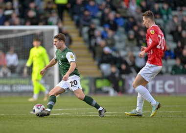 Plymouth Argyle orta saha oyuncusu Adam Randell (20), Sky Bet League 1 karşılaşmasında Plymouth Argyle ile Morecambe arasında 17 Aralık 2022 'de Home Park, Plymouth, İngiltere' de karşılaştı.