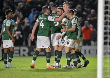 GoAL Plymouth Argyle oyuncuları, 17 Aralık 2022 'de Home Park, Plymouth, İngiltere' de oynanan Sky Bet Lig 1 karşılaşmasında 2-0 'lık galibiyet golünü kutluyor.