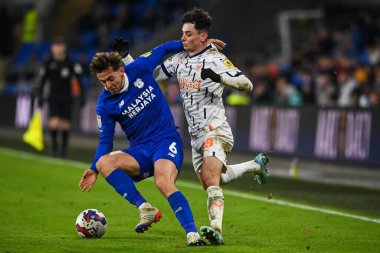 Cardiff City - Blackpool Stadyumu, Cardiff, İngiltere 'de 17 Aralık 2022' de oynanan Cardiff City - Blackpool maçında Cardiff City # 6 numaralı Cardiff City maçında Blackpool topu için mücadele etti.