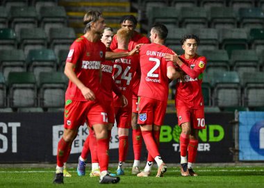 AFC Wimbledon orta saha oyuncusu Ayoub Assal (10), Papa John 's Trophy maçı Plymouth Argyle-AFC Wimbledon maçında 21 Aralık 202' de Home Park, Plymouth, Birleşik Krallık 'ta 0-3 berabere kalma golünü kutluyor.
