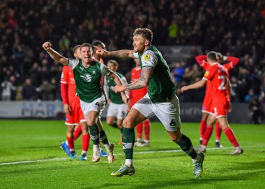 GoAL Plymouth Argyle defans oyuncusu Dan Scarr (6), 29 Aralık 202 tarihinde Home Park, Plymouth, İngiltere 'de oynanan Sky Bet League 1 karşılaşmasında 1-0' lık skorla Plymouth Argyle-Wycombe Wanderers karşılaşmasını kutluyor.
