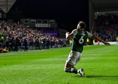 GoAL Plymouth Argyle defans oyuncusu Dan Scarr (6), 29 Aralık 202 tarihinde Home Park, Plymouth, İngiltere 'de oynanan Sky Bet League 1 karşılaşmasında 1-0' lık skorla Plymouth Argyle-Wycombe Wanderers karşılaşmasını kutluyor.