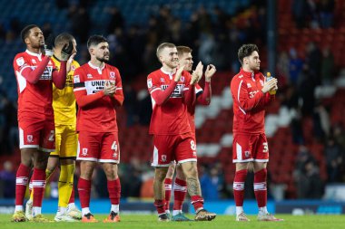 Middlesborough oyuncuları, 29 Aralık 2022 'de İngiltere' nin Blackburn kentinde oynanan Blackburn Rovers-Middlesbrough maçından sonra taraftarlarıyla kutlama yaptılar.