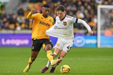 Wolverhampton Wanderers 'ın 22 numarası Nlson Semedo Premier League maçında Manchester United' ın 49 numaralı oyuncusu Alejandro Garnacho 'ya karşı 31 Aralık 2022' de Molineux, Wolverhampton, Birleşik Krallık 'ta oynanan maçta faul yaptı.
