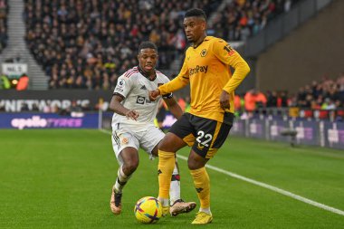 Wolverhampton Wanderers 'dan Nlson Semedo # 22 Premier League maçında Manchester United' a karşı Wolverhampton Wanderers, Wolineux, Wolverhampton, Birleşik Krallık 'ta 31 Aralık 2022' de oynanan maçta Tyrell Malacia # 12 'den baskı gördü.