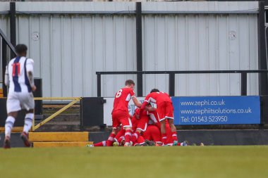 Middlesbrough oyuncuları, 5 Ocak 202 'de Keys Park, Hednesford, Birleşik Krallık' ta oynanan Premier Lig Kupası Batı Bromwich Albion vs Middlesbrough U23 karşılaşmasında 0-1 kazanma golünü kutladılar.