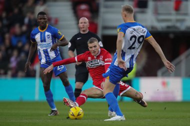 Riley McGree #8 of Middlesbrough goes in on Jan Paul van Hecke #29 of Brighton & Hove Albion during the Emirates FA Cup Third Round match Middlesbrough vs Brighton and Hove Albion at Riverside Stadium, Middlesbrough, United Kingdom, 7th January 202 clipart