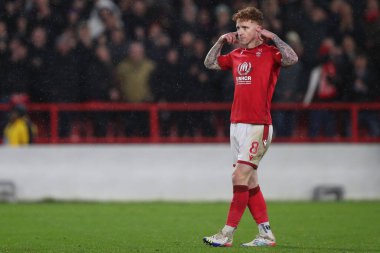 Jack Colback #8 of Nottingham Forest puts his fingers in his ears and celebrates scoring his penalty in the shootout during the Carabao Cup Quarter Final match Nottingham Forest vs Wolverhampton Wanderers at City Ground, Nottingham, United Kingdom, 1