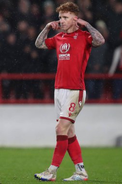 Jack Colback #8 of Nottingham Forest puts his fingers in his ears and celebrates scoring his penalty in the shootout during the Carabao Cup Quarter Final match Nottingham Forest vs Wolverhampton Wanderers at City Ground, Nottingham, United Kingdom, 1