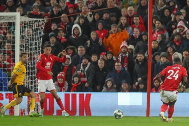 Serge Aurier #24 of Nottingham Forest has a shot at goal which is blocked by Jonny #19 of Wolverhampton Wanderers during the Carabao Cup Quarter Final match Nottingham Forest vs Wolverhampton Wanderers at City Ground, Nottingham, United Kingdom, 11th
