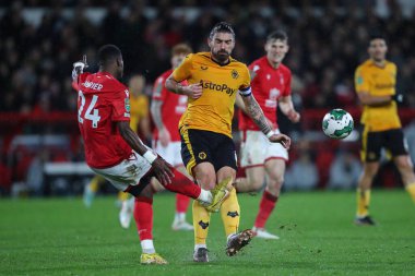 Serge Aurier #24 of Nottingham Forest clears the ball from Rubn Neves #8 of Wolverhampton Wanderers during the Carabao Cup Quarter Final match Nottingham Forest vs Wolverhampton Wanderers at City Ground, Nottingham, United Kingdom, 11th January 2023