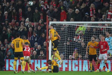 Max Kilman #23 of Wolverhampton Wanderers heads the ball from danger during the Carabao Cup Quarter Final match Nottingham Forest vs Wolverhampton Wanderers at City Ground, Nottingham, United Kingdom, 11th January 202