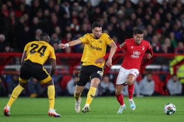 Brennan Johnson #20 of Nottingham Forest and Max Kilman #23 of Wolverhampton Wanderers tussle for the ball during the Carabao Cup Quarter Final match Nottingham Forest vs Wolverhampton Wanderers at City Ground, Nottingham, United Kingdom, 11th Januar