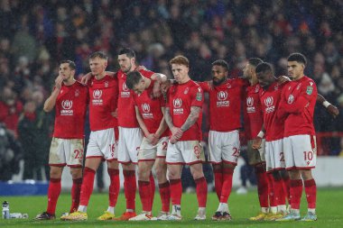 Nottingham Forest players watch on as Joe Worrall #4 of Nottingham Forest takes his penalty during the Carabao Cup Quarter Final match Nottingham Forest vs Wolverhampton Wanderers at City Ground, Nottingham, United Kingdom, 11th January 202