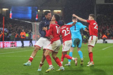 Morgan Gibbs-White #10 of Nottingham Forest and Brennan Johnson #20 of Nottingham Forest celebrate their teams win after the Carabao Cup Quarter Final match Nottingham Forest vs Wolverhampton Wanderers at City Ground, Nottingham, United Kingdom, 11th