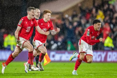 Morgan Gibbs-White #10 of Nottingham Forest leads the celebrations after winning the penalty shootout during the Carabao Cup Quarter Final match Nottingham Forest vs Wolverhampton Wanderers at City Ground, Nottingham, United Kingdom, 11th January 202