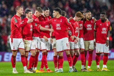 Morgan Gibbs-White #10 of Nottingham Forest is congratulated by Joe Worrall #4 of Nottingham Forest after his penalty during the Carabao Cup Quarter Final match Nottingham Forest vs Wolverhampton Wanderers at City Ground, Nottingham, United Kingdom, 