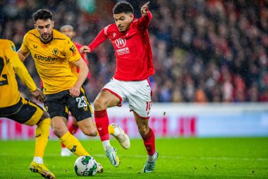 Morgan Gibbs-White #10 of Nottingham Forest looks for a way through the Wolves defence during the Carabao Cup Quarter Final match Nottingham Forest vs Wolverhampton Wanderers at City Ground, Nottingham, United Kingdom, 11th January 202