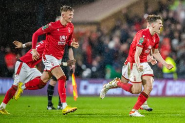 Ryan Yates #22 of Nottingham Forest and Sam Surridge #16 of Nottingham Forest celebrate after going through to the semi finals on penalties during the Carabao Cup Quarter Final match Nottingham Forest vs Wolverhampton Wanderers at City Ground, Nottin
