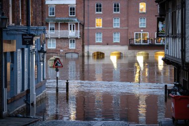 Local business are flooded as heavy rain causes the River Ouse in York burst its banks flooding buildings in York City Centre, York, United Kingdom, 12th January 202