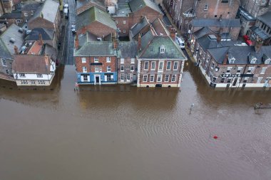 Business are flooded out as heavy rain causes the River Ouse in York burst its banks flooding buildings in York City Centre, York, United Kingdom, 12th January 202 clipart