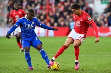 Brennan Johnson #20 of Nottingham Forest is tackled by Nampalys Mendy #24 of Leicester City during the Premier League match Nottingham Forest vs Leicester City at City Ground, Nottingham, United Kingdom, 14th January 202