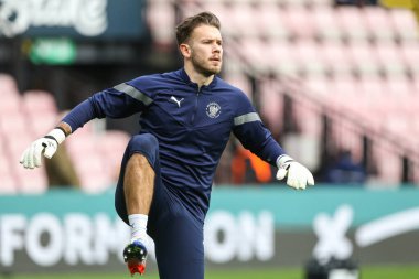Chris Maxwell #1 of Blackpool warms up during the Sky Bet Championship match Watford vs Blackpool at Vicarage Road, Watford, United Kingdom, 14th January 202