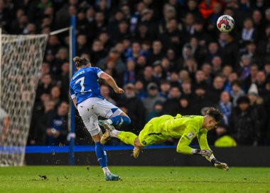 Plymouth Argyle goalkeeper Michael Cooper  (1) makes a brave head clearance out of the big box with his head while under pressure from Ipswich Town forward Wes Burns  (7) during the Sky Bet League 1 match Ipswich Town vs Plymouth Argyle at Portman Ro