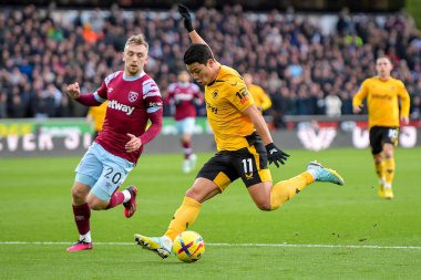 Hwang Hee-Chan #11 of Wolverhampton Wanderers has a shot during the Premier League match Wolverhampton Wanderers vs West Ham United at Molineux, Wolverhampton, United Kingdom, 14th January 202