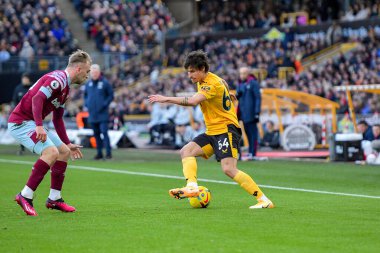 Hugo Bueno #64 of Wolverhampton Wanderers takes on Jarrod Bowen #20 of West Ham United during the Premier League match Wolverhampton Wanderers vs West Ham United at Molineux, Wolverhampton, United Kingdom, 14th January 202