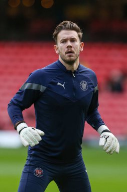 Chris Maxwell #1 of Blackpool warms up during the Sky Bet Championship match Watford vs Blackpool at Vicarage Road, Watford, United Kingdom, 14th January 202