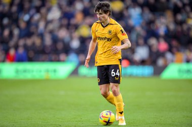 Hugo Bueno #64 of Wolverhampton Wanderers with the ball  during the Premier League match Wolverhampton Wanderers vs West Ham United at Molineux, Wolverhampton, United Kingdom, 14th January 202