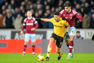 Raul Jimenez #9 of Wolverhampton Wanderers holds off a challenge from Lucas Paqueta #11 of West Ham United during the Premier League match Wolverhampton Wanderers vs West Ham United at Molineux, Wolverhampton, United Kingdom, 14th January 202