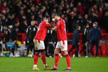 Serge Aurier #24 of Nottingham Forest and Scott McKenna #26 celebrates their sides win with the fans at the end of the Premier League match Nottingham Forest vs Leicester City at City Ground, Nottingham, United Kingdom, 14th January 202