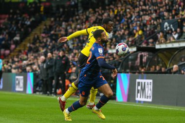 CJ Hamilton #22 of Blackpool and Jeremy Ngakia #2 of Watford tussle for the ball during the Sky Bet Championship match Watford vs Blackpool at Vicarage Road, Watford, United Kingdom, 14th January 202