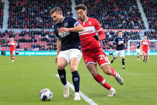 Matt Crooks #25 of Middlesbrough and Shaun Hutchinson #4 of Millwall battle for the ball during the Sky Bet Championship match Middlesbrough vs Millwall at Riverside Stadium, Middlesbrough, United Kingdom, 14th January 202