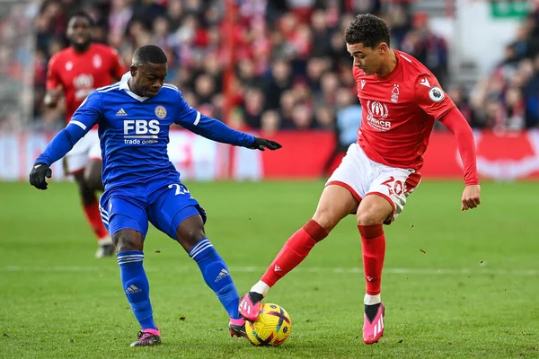 Brennan Johnson #20 of Nottingham Forest is tackled by Nampalys Mendy #24 of Leicester City during the Premier League match Nottingham Forest vs Leicester City at City Ground, Nottingham, United Kingdom, 14th January 202