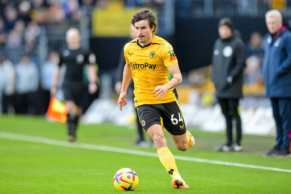 Hugo Bueno #64 of Wolverhampton Wanderers with the ball during the Premier League match Wolverhampton Wanderers vs West Ham United at Molineux, Wolverhampton, United Kingdom, 14th January 202